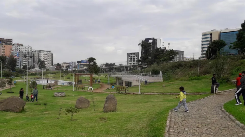 Hamle 19 Park — open lawns and landscaped picnic ground under the city skyline, Addis Ababa