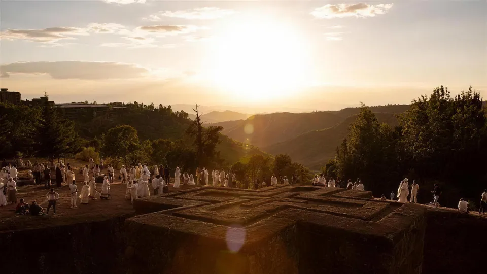 Pilgrims at the Bete Giyorgis rock-hewn church at sunrise, Lalibela, Ethiopia